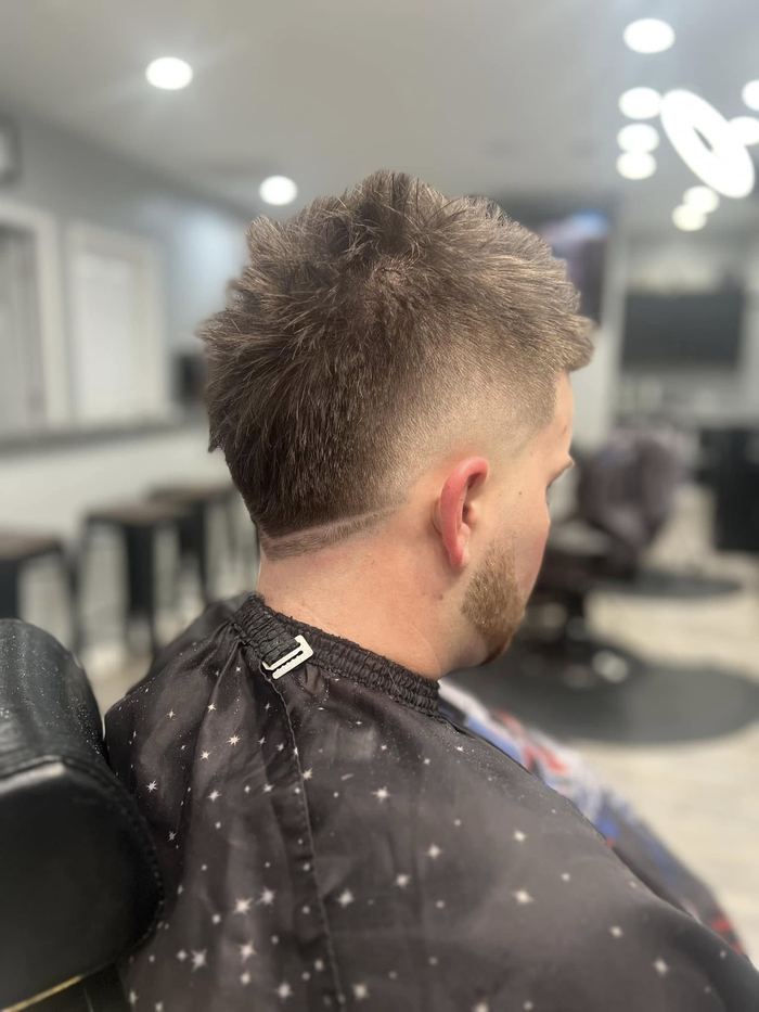Spiked top with high fade